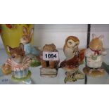Four Beswick Beatrix Potter figurines comprising Peter Rabbit, Mr Jackson, Old Mr Brown, and Mrs