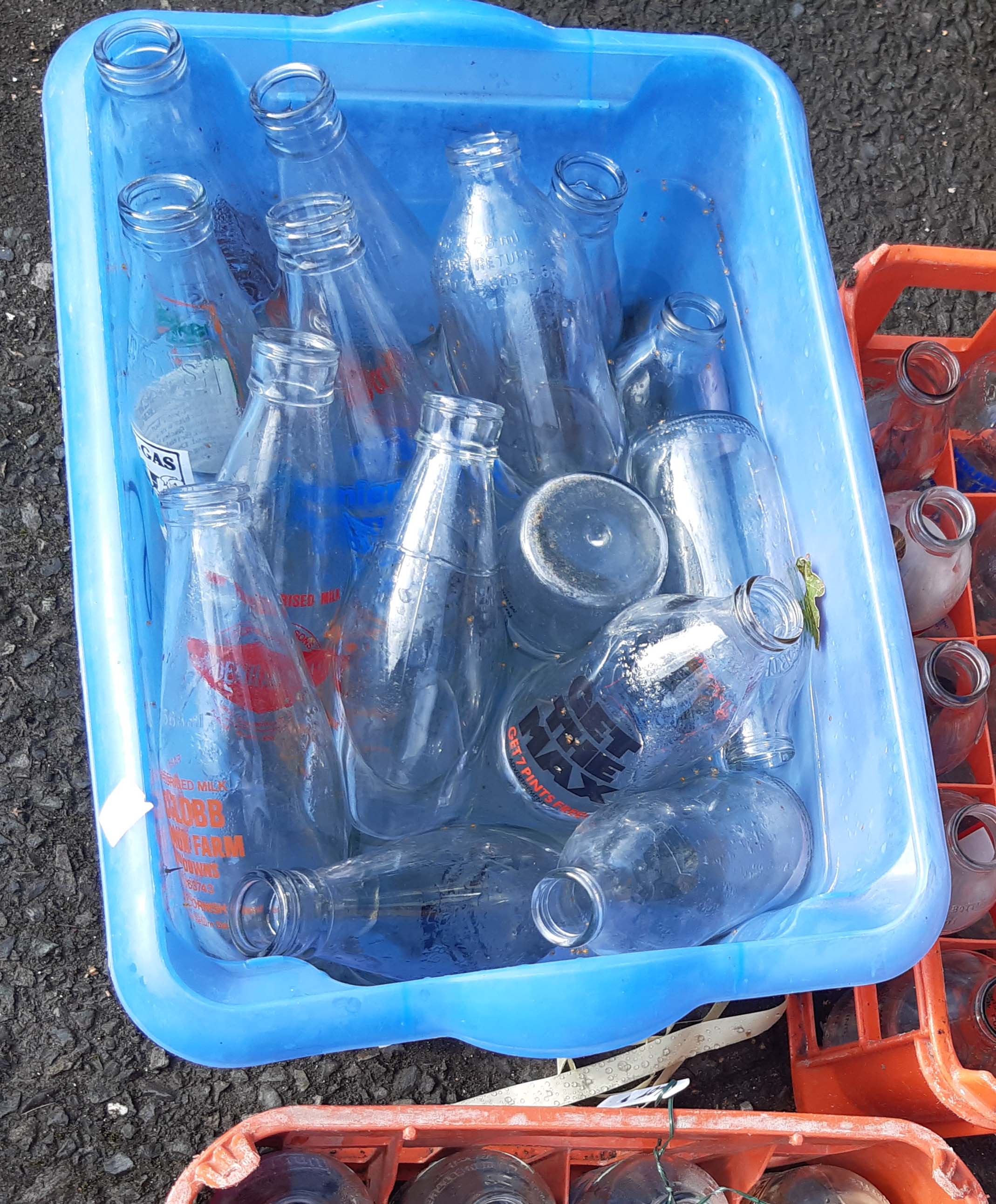 A vintage Unigate plastic milk crate containing twenty assorted advertising milk bottles - sold with - Image 2 of 2