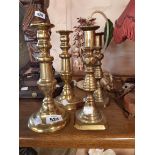 Pair of Victorian Brass Candlesticks sold with a smaller similar