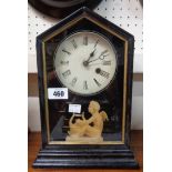 A late 19th Century ebonised wood cased American shelf clock with decorative glazed front