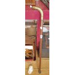 A brass snake handled walking stick with inset Fitted Spirit Glass