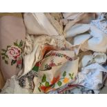 A box containing assorted linen including table runners, etc.