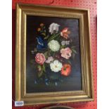 E. Chadderton: a gilt framed oil on board still life entitled "Flowers in a Blue Vase"