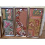A set of three gilt framed applique textile panels in the Oriental style