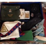 A leather case containing a quantity of Masonic regalia including jewels