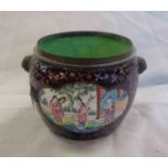 An old Cantonese brass and enamel bowl, decorated with panels depicting figural groups with a purple