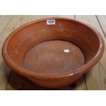 A terracotta part glazed cream pan