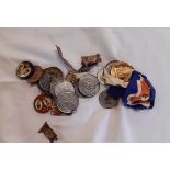 A bag containing assorted medals, medallions and badges