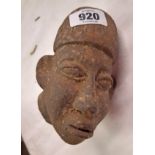 An antique north African pottery head of a boy