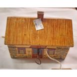 A vintage painted jewellery box in the form of a thatched cottage