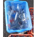 A vintage Unigate plastic milk crate containing twenty assorted advertising milk bottles - sold with