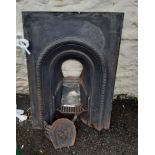 A Victorian cast iron bedroom fireplace insert