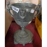A large pewter cup with neo-Classical decoration