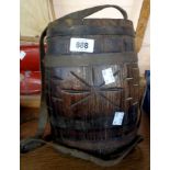 An old coopered costrel barrel with leather hanging straps