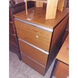 A 19" vintage teak effect three drawer filing cabinet with aluminium handles and black painted metal
