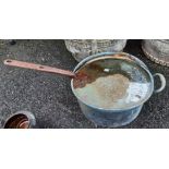 A Victorian copper saucepan and lid, with iron handles
