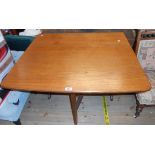 A 36" retro G-Plan style teak effect drop-leaf dining table, set on shaped standard ends - some edge