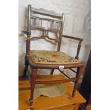 An Edwardian inlaid walnut framed elbow chair with upholstered seat panel, set on square tapered