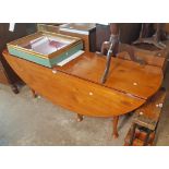 A 6' 4" Irish stained alder drop-leaf wake table with single gated action, set on tapered legs