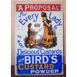 A reproduction enamel Bird`s Custard sign