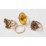 A white metal ring, set with amber cabochon containing a large fly - sold with three other white