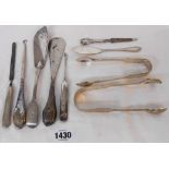 A pair of antique Exeter silver sugar tongs a/f, pair of London fiddle pattern tongs and other small