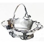 A 10 1/4" Victorian silver fruit basket with crimped rim cast hadle and similar base - London 1886
