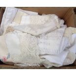 A box of linen including tablecloths, runners, mats, etc.