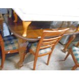 A 19th Century mahogany extending dining table with gadrooned edge and winder, set on heavy acanthus