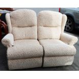 A modern upholstered two seater reclining settee