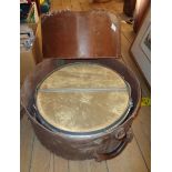 A vintage jazz snare drum and hi-hat cymbal, both in travelling cases