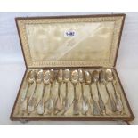 A cased set of twelve late 19th Century French Minerva marked ornate white metal teaspoons with