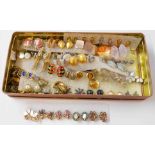 A tin containing a large collection of good quality costume jewellery ear-rings