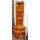 A 25" Nathan Furniture retro design teak effect corner unit with open shelves, recess and double