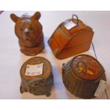 Four novelty inkwells comprising Japanese fish basket, carved Black Forest Villars bear's head, coal