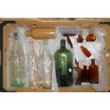 A box containing assorted bottles including South Devon mineral water, Schweppes, etc.