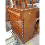 A 3' 6" Victorian mahogany chest with blind frieze drawer, flanking half barley twist decoration and