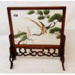 A Chinese table screen with double sided embroidery under glass depicting a bird in a tree with seal