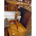 An 18 1/4" reproduction mahogany pedestal table with inlaid floral decoration to top, set on