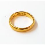 A hallmarked 22ct. gold wedding band - 5.1grms