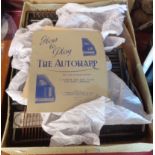 A boxed Autoharp with instructions and music