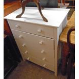 A 28 1/4" modern white finish chest of four long drawers, set on block feet