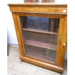 A 30" 19th Century inlaid walnut pier cabinet with material lined shelves enclosed by a glazed panel