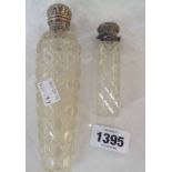 Two Victorian silver topped hobnail glass scent bottles the larger with damaged glass the smaller