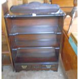 A 31" antique style dark stained wood and ebonised three shelf open bookcase with drawer under,