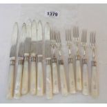 A set of six silver fruit knives and forks with mother-of-pearl handles by the same maker bearing