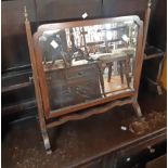 A 20th Century mahogany framed swing dressing table mirror in the antique style with shaped bevelled