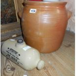 A French salt glazed stoneware crock and a stoneware foot warmer