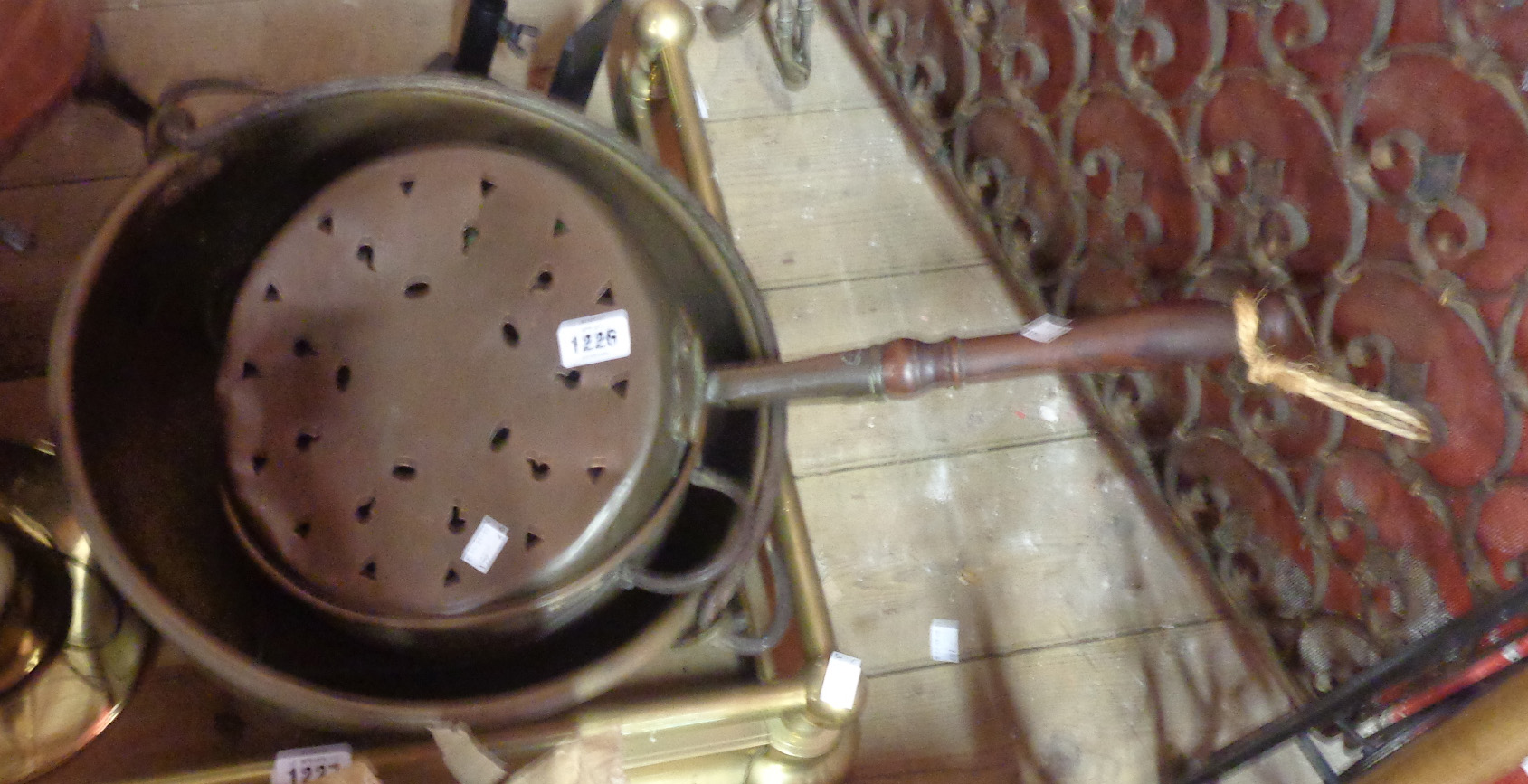 A brass pan with iron swing handle, another similar and a warming pan