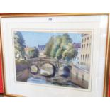 D.W. Burley: a gilt framed watercolour, depicting a townscape as viewed from a river with bridge